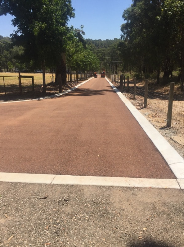 This is a photo of a hot spray & seal bitumen roadway which is in the process of being installed by Narrabri Asphalt & Bitumen