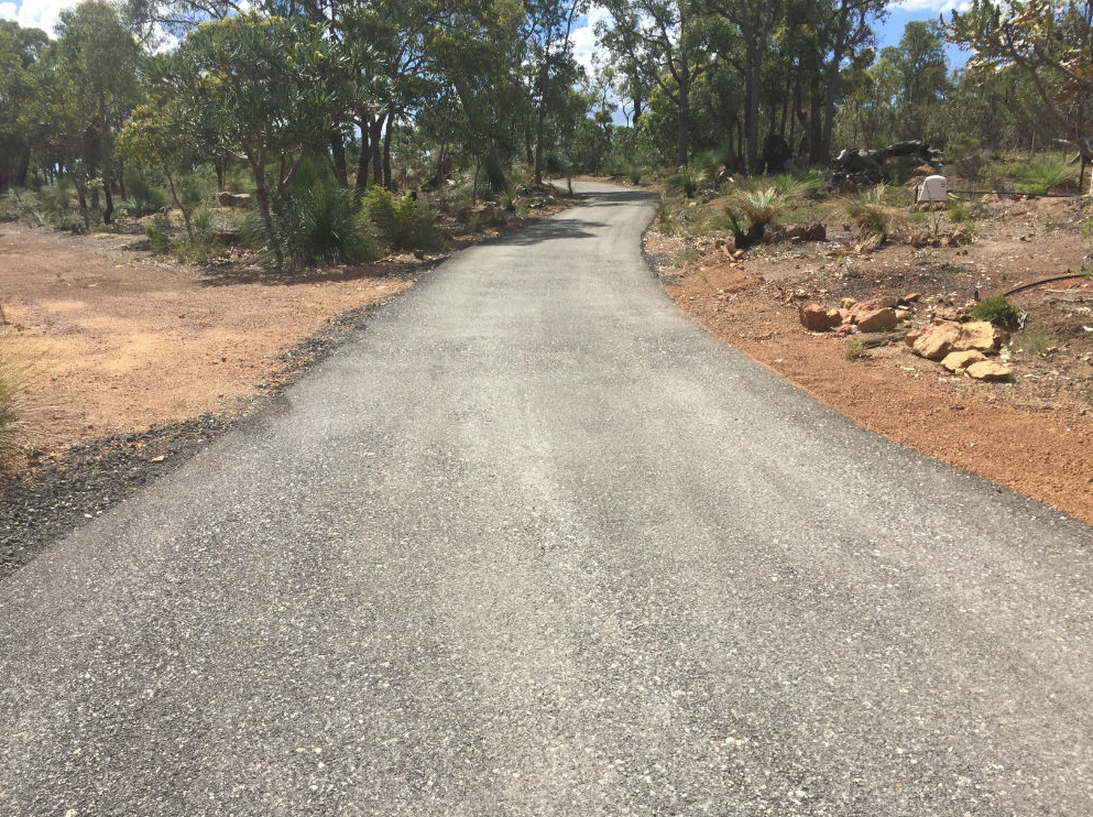 This is a photo of a hot spray & seal bitumen driveway which is in the process of being installed by Narrabri Asphalt & Bitumen